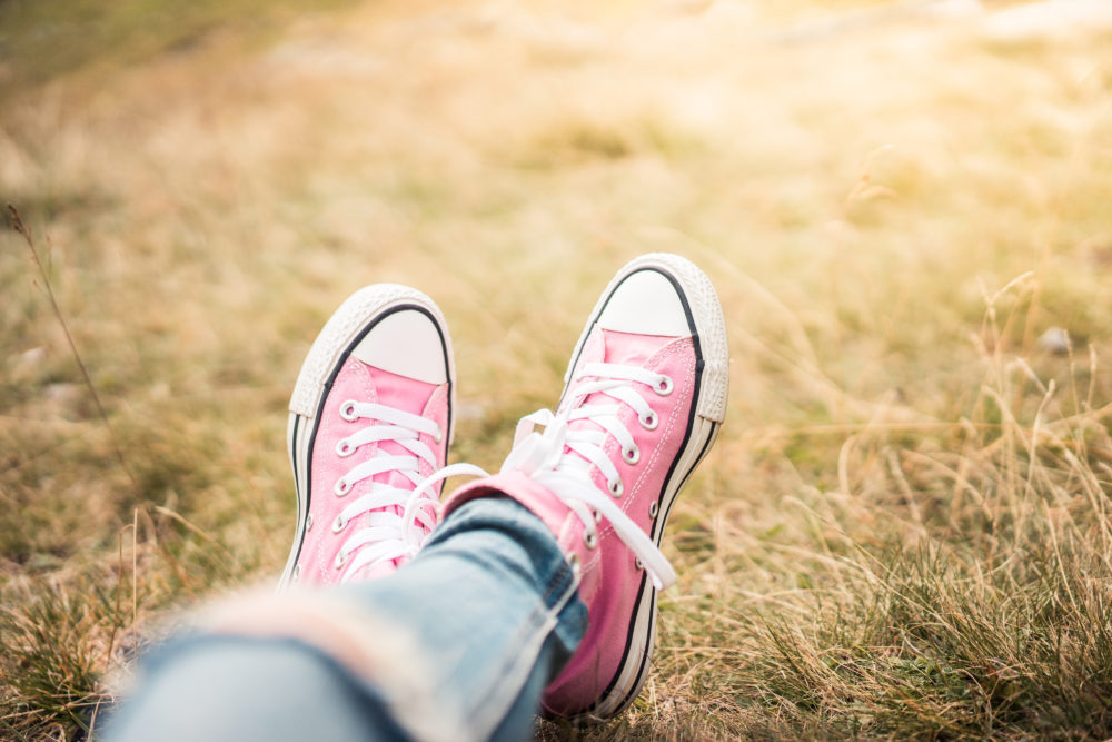 girl-with-pink-shoes-laying-in-meadow-picjumbo-com.jpg